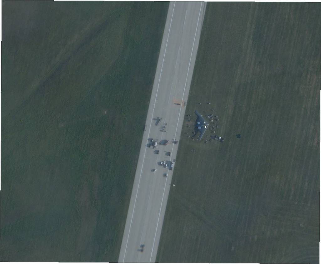 Satellite imagery provided by Planet Labs shows a B-2 Spirit bomber next to the runway at Whiteman Air Force Base, Missouri, after it suffered an in-flight malfunction and crash-landed shortly after midnight on Sept. 15, 2021. The photo was taken at 8:24 am local time. Photo courtesy of Planet Labs.