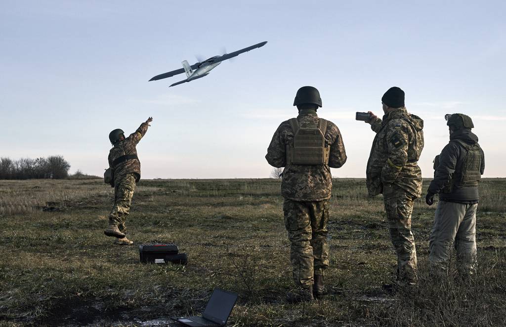 Ukrainian soldiers launch a drone at Russian positions near Bakhmut, Donetsk region, Ukraine, Thursday, Dec. 15, 2022.