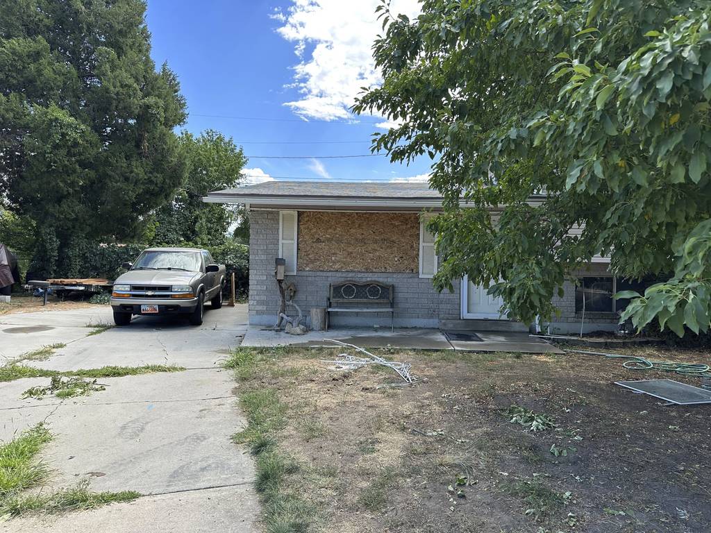 This photo shows a boarded up window at the home of Craig Robertson, Thursday, Aug 10, 2023, in Provo, Utah.