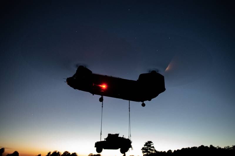 U.S. Army paratroopers perform night sling operations with a CH-47 Chinook in preparation for Exercise Saber Junction 20 on Aug. 5, 2020, as part of the 173rd Brigade Field Training Exercise in Grafenwoehr Training Area, Germany.