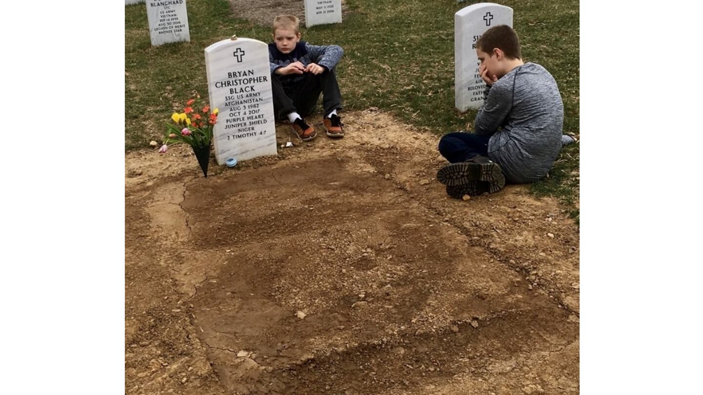 Bryan Black's sons Ezekiel and Isaac visit their father's grave. (Courtesy of Henry Black)