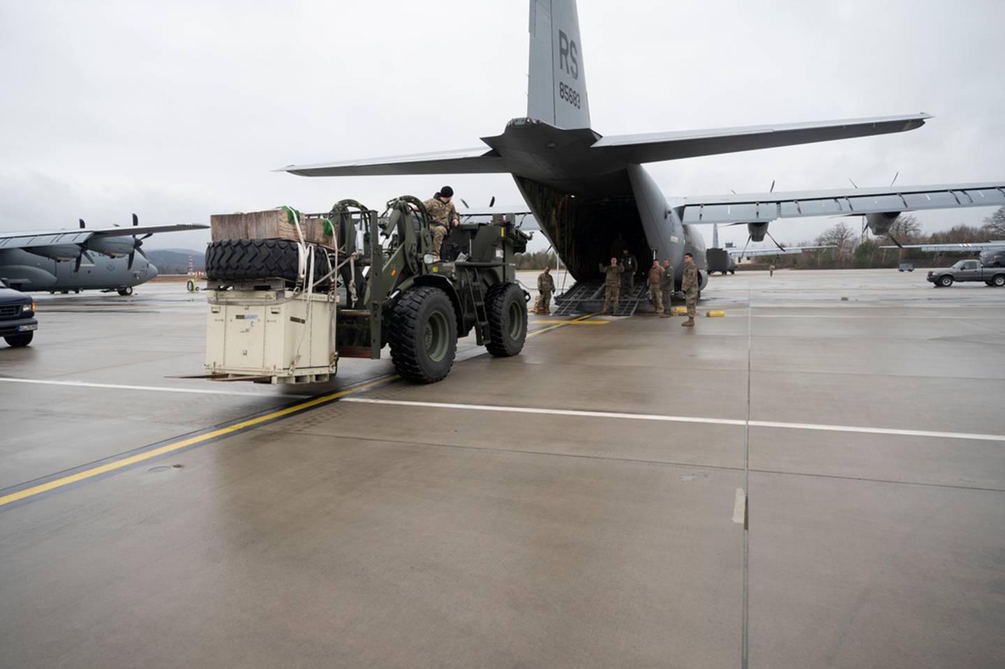Airmen assigned to the 86th Airlift Wing load supplies onto a C-130J Super Hercules aircraft at Ramstein Air Base, Germany, Feb. 4, 2022. U.S. Air Forces in Europe are prepared and strategically positioned to rapidly surge forces into and across the region in order to support the alliance and defend against any aggression. (Senior Airman Thomas Karol/Air Force)