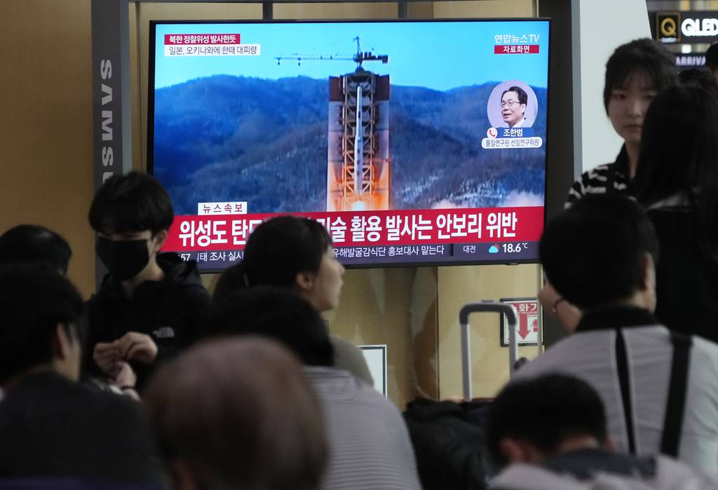 A TV screen shows a file image of North Korea's rocket launch during a news program at the Seoul Railway Station in Seoul, South Korea, Wednesday, May 31, 2023.