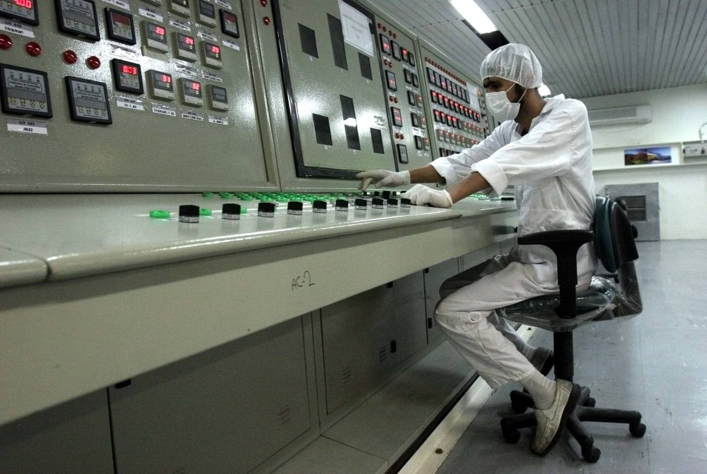 In this Feb. 3, 2007, file photo, an Iranian technician works at the Uranium Conversion Facility just outside the city of Isfahan, Iran, 255 miles (410 kilometers) south of the capital Tehran.