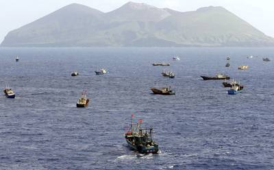 Foreign vessels, some of them have Chinese flags, fish near Torishima, Japan, on Oct. 31, 2014.