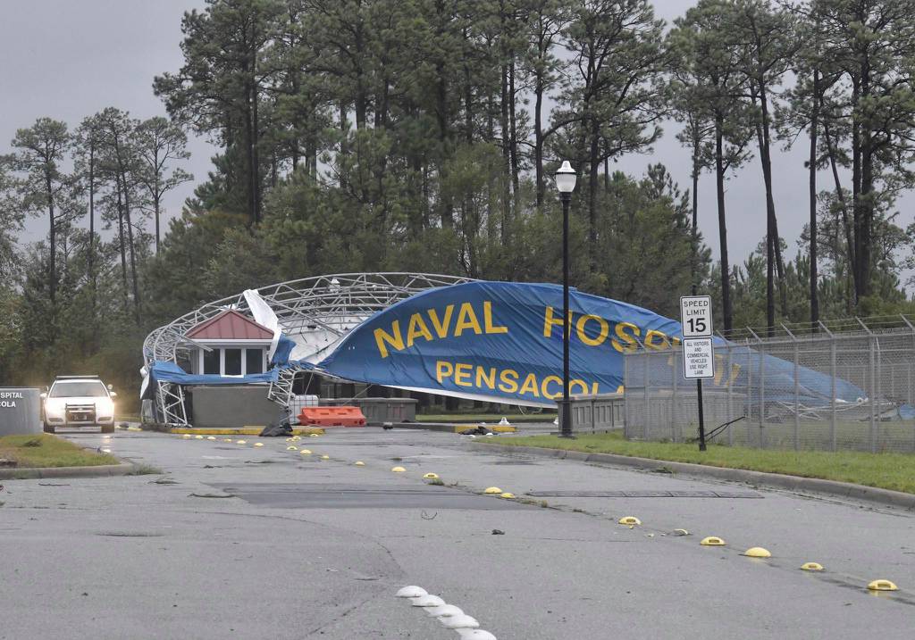The Pensacola Naval Hospital banner acted as a sail as high winds from Hurricane Sally tore down its support scaffolding on Thursday, Sept. 17, 2020.