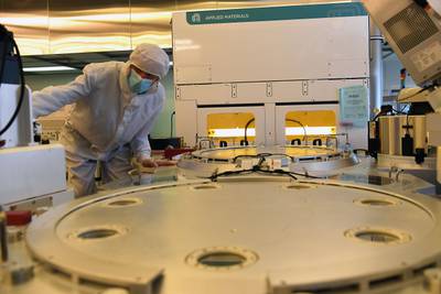 An engineer works in the clean-room facilities at the LETI, a French research institute for electronics and information technologies founded by the French Alternative Energies and Atomic Energy Commission.