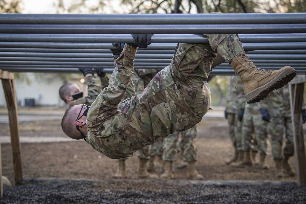 A U.S. Space Force trainee participates on the over-and-under bars obstacle during Basic Expeditionary Airman Skills Training at Joint Base San Antonio-Chapman Annex, Texas, Dec. 2, 2020.