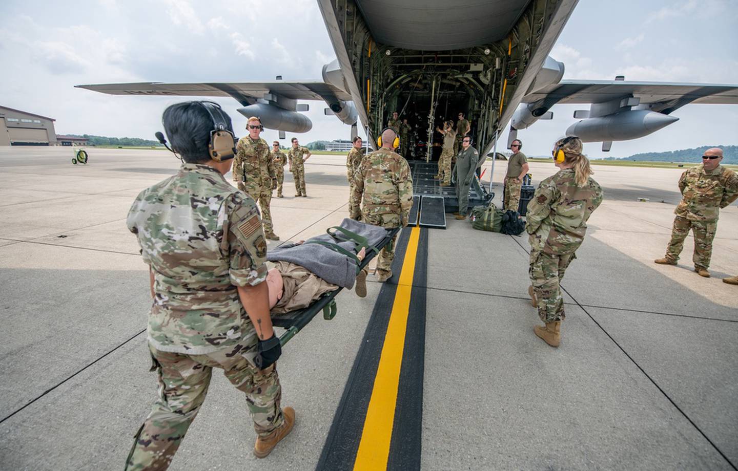 Members of the 130th Airlift Wing perform aeromedical evacuation drills as part of the week-long joint training exercise Sentry Storm at McLaughlin Air National Guard Base in Charleston, West Virginia, July 21, 2021. (Edwin L. Wriston/Army National Guard)