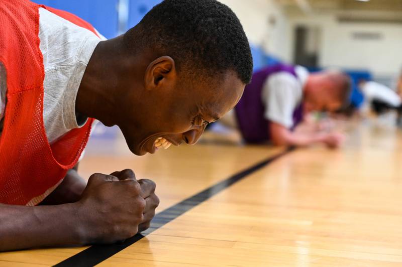 Airman 1st Class Sena Zohou, assigned to the 8th Communication Squadron, grimaces during the plank component portion of the Air Force's physical fitness assessment beta test at Kunsan Air Base, South Korea, August 26, 2021. (Tech. Sgt. James Cason/Air Strength)