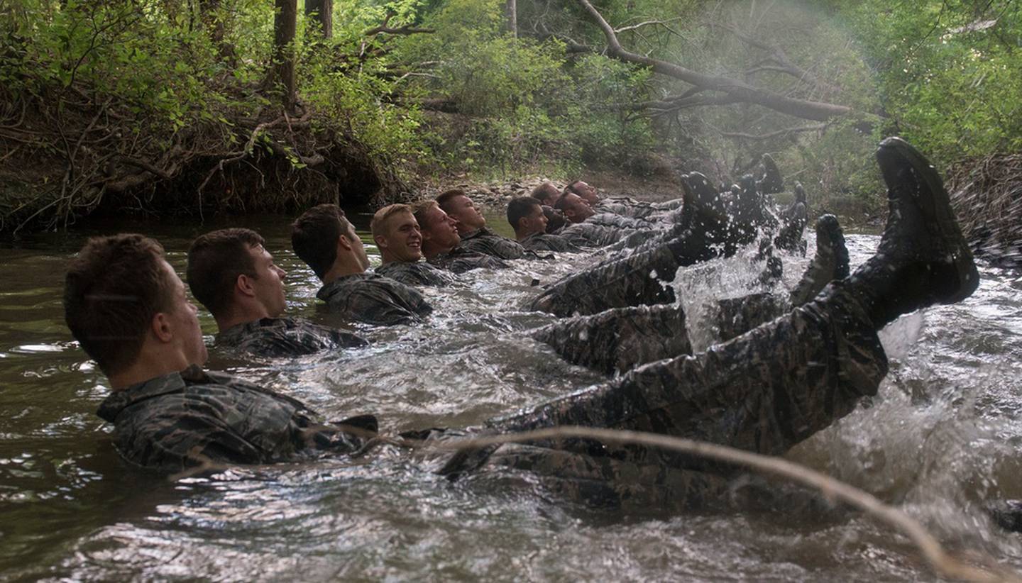 Battlefield airmen candidates, having just completed the Battlefield Airmen Training Group’s combat controller course of initial entry, perform flutter kicks in a creek Aug. 30, 2018 at Joint Base San Antonio-Medina Annex, Texas. The Battlefield Airmen Training Group’s mission is to select, train and mentor airmen for global combat operations. (Airman 1st Class Dillon Parker/Air Force)