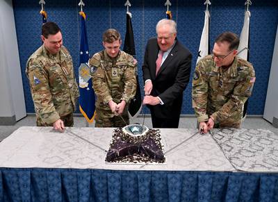 Air Force Secretary Frank Kendall cuts a birthday cake for the Space Force