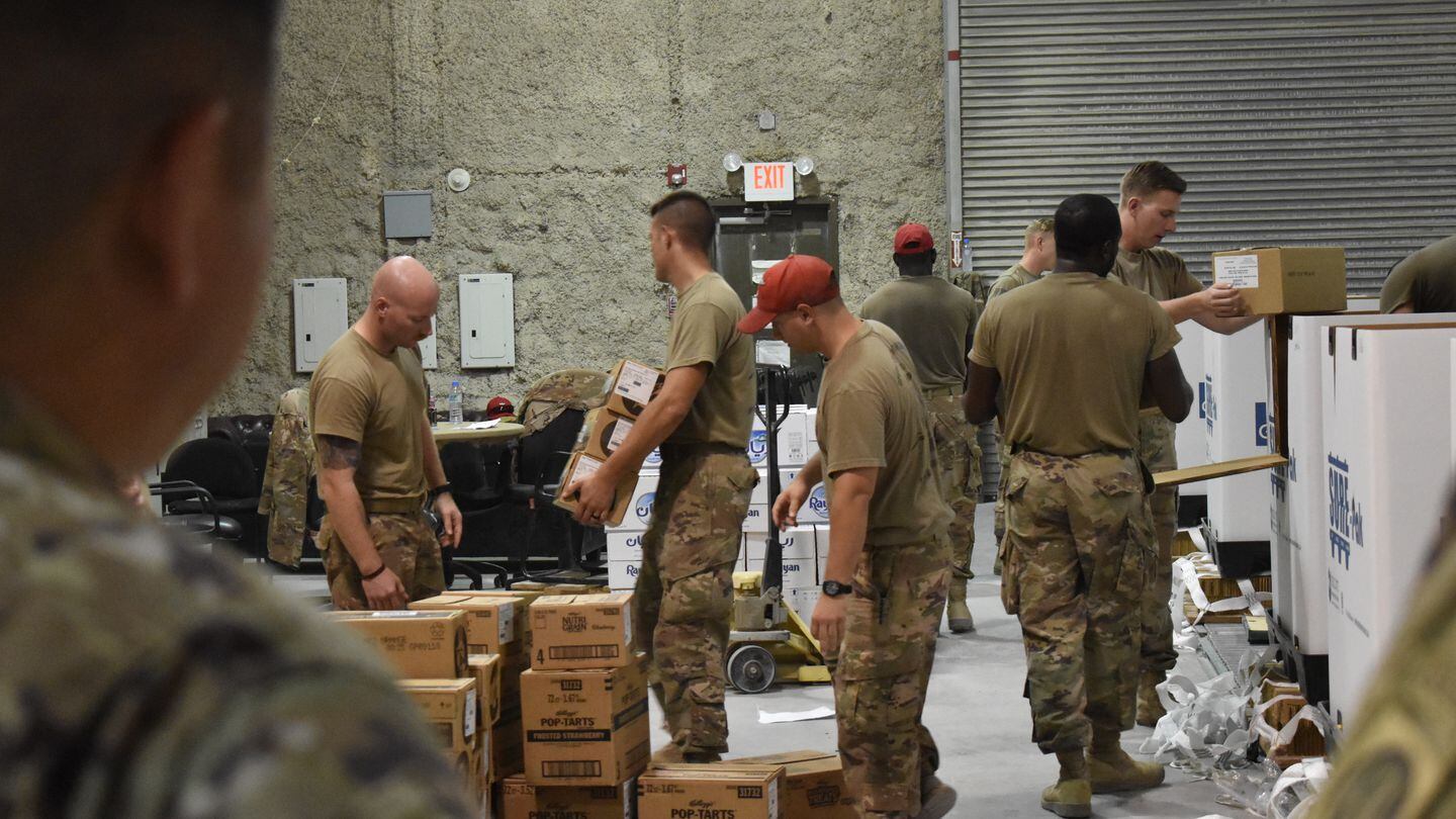 Soldiers unload boxes of Pop-Tarts. (Staff Sgt. David Clemenko/Army)