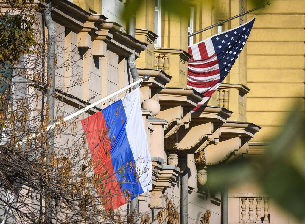 A Russian flag flies next to the US Embassy building in Moscow on Oct. 22, 2018.