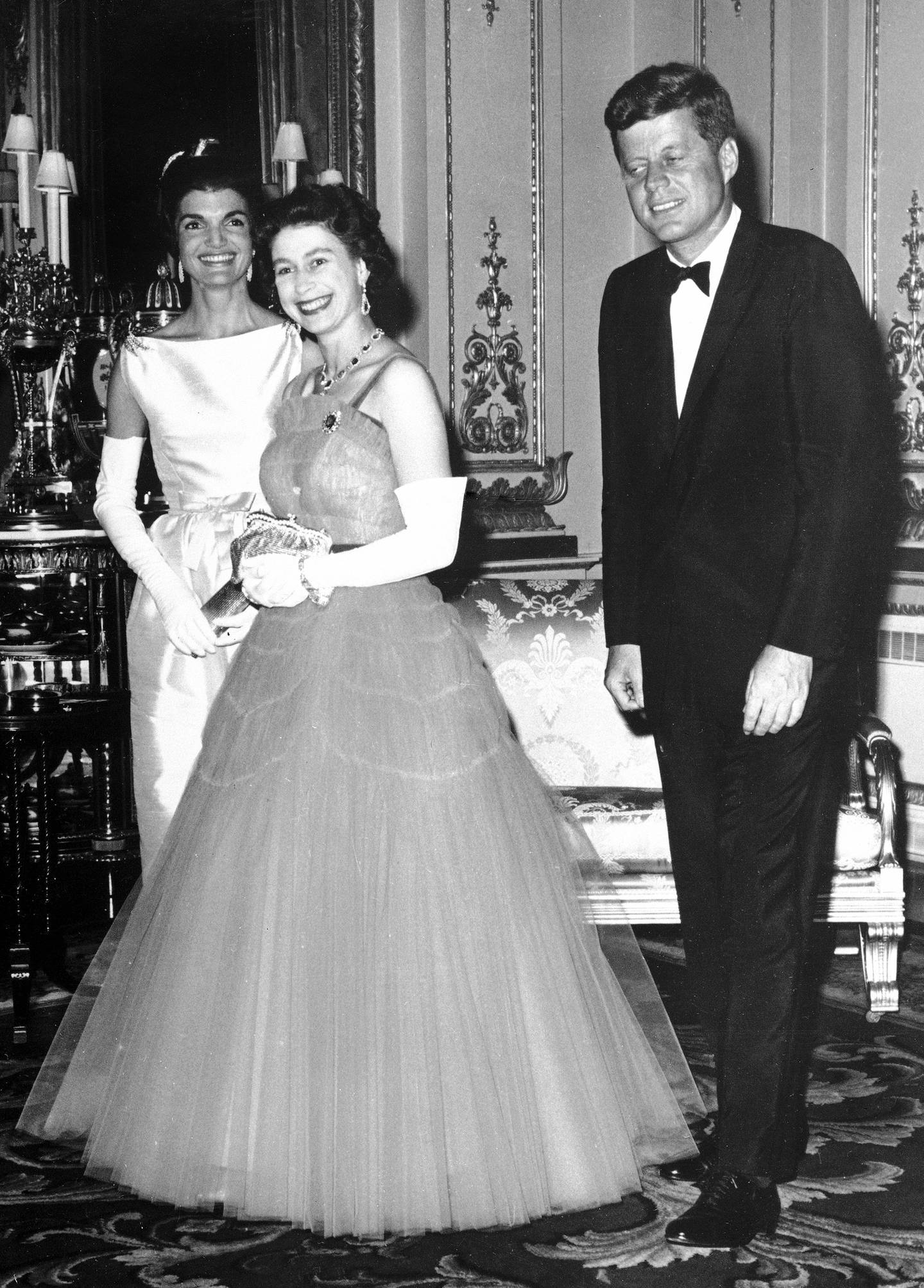 In this file photo dated June 5, 1961, Britain's Queen Elizabeth II, centre, walks with US President John F. Kennedy, right, and his wife Jacqueline Kennedy, as they enter an ante-room in Buckingham Palace, London, before a dinner given by the Queen in honor of the visiting President and his wife.