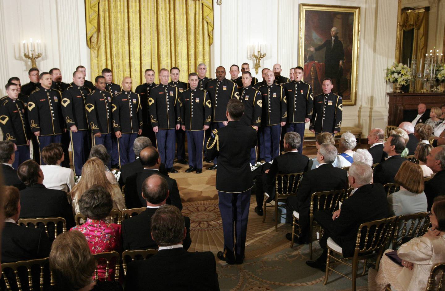 The US Army Chorus sings for US President George W. Bush, Queen Elizabeth II and invited guests in the East Room after a State Dinner at the White House in Washington, DC, May 7, 2007.