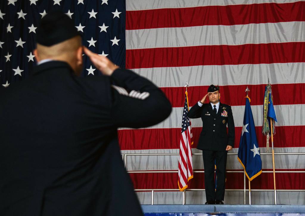 Col. Lawrence T. Sullivan, incoming 20th Fighter Wing commander, receives his first salute as commander from Chief Master Sgt. Steve C. Cenov, incoming 20th FW command chief.