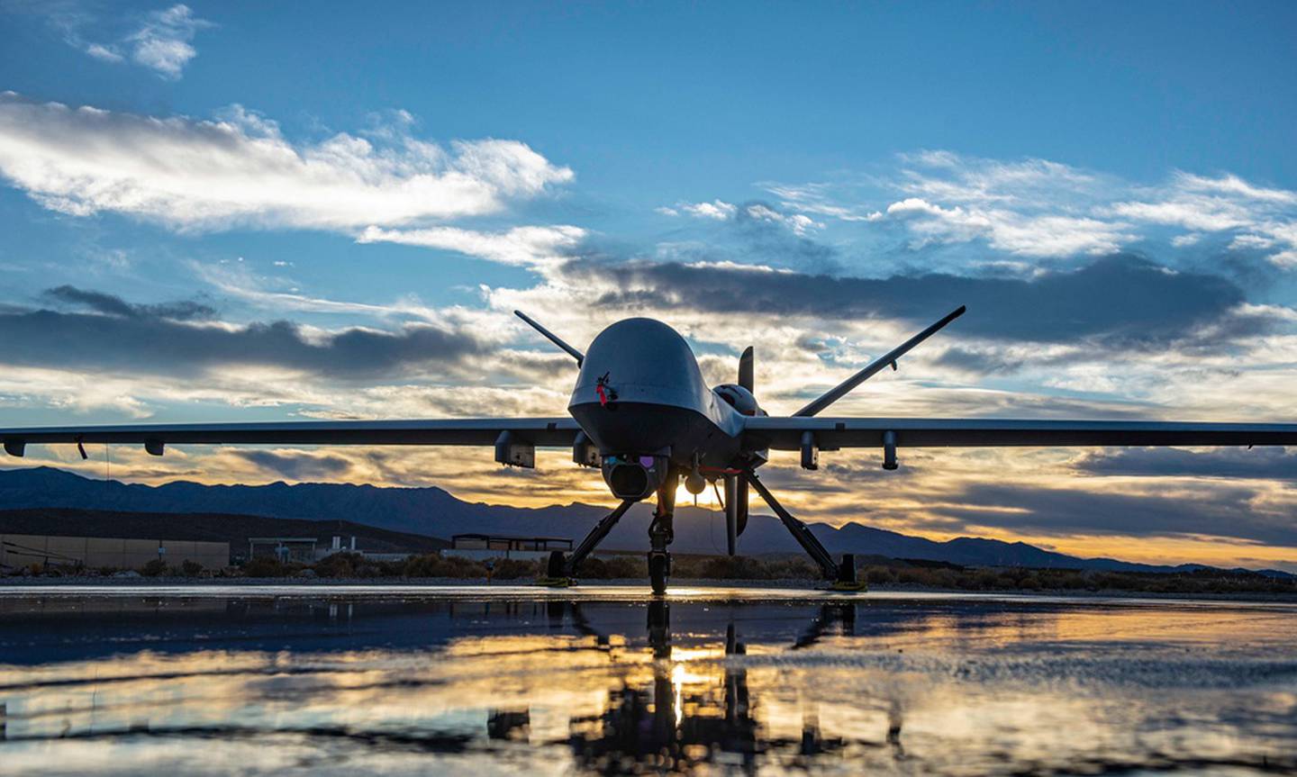 An MQ-9 Reaper sits along the flight line during sunset at Creech Air Force Base, Nevada, Nov. 17, 2020. (Robert Brooks/Air Force)