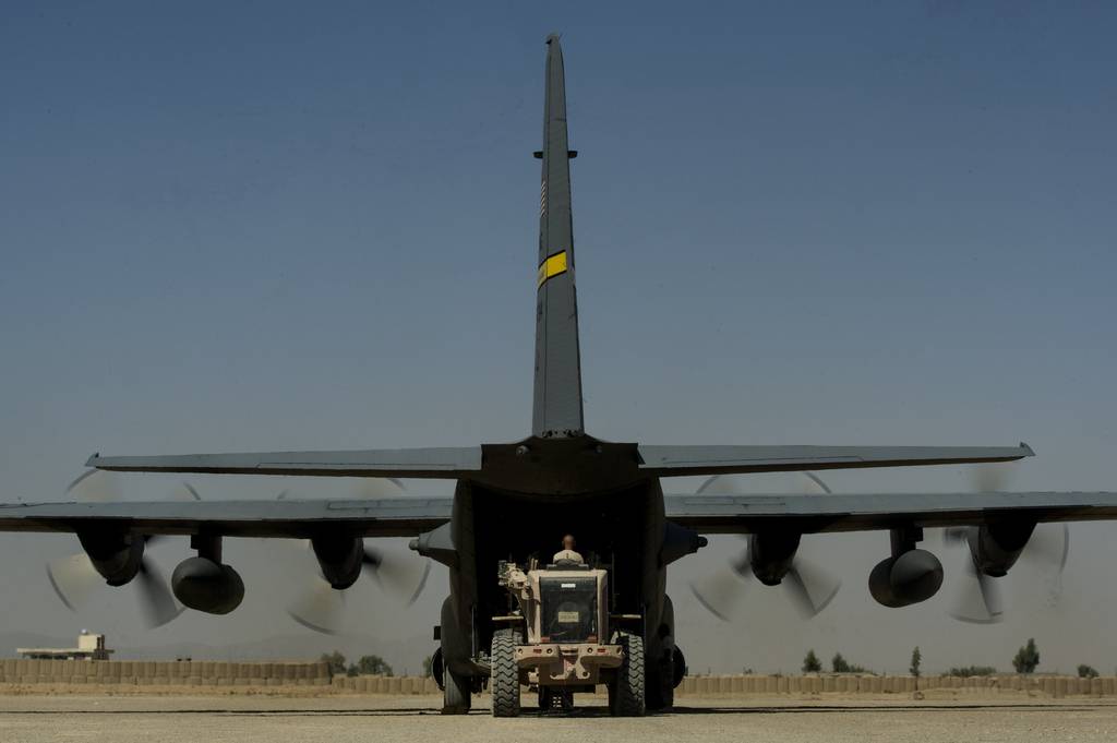 U.S. Air Force Air Mobility Division personnel load retrograde cargo on to an U.S. Air National Guard C-130H Hercules at Forward Operating Base Farah in western Afghanistan, Oct. 20, 2013. The C-130H is deployed from the 153rd Airlift Wing, Wyoming ANG.
