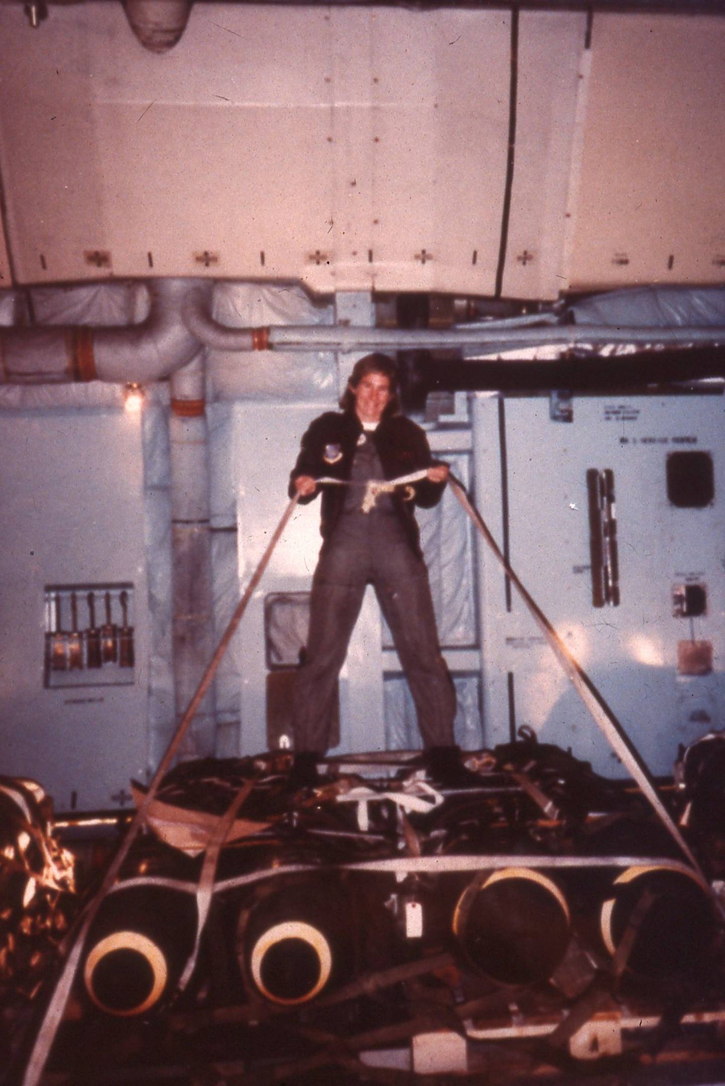Maj. Stephanie Wells with a load of bombs on a C-5 during Desert Shield/Desert Storm.