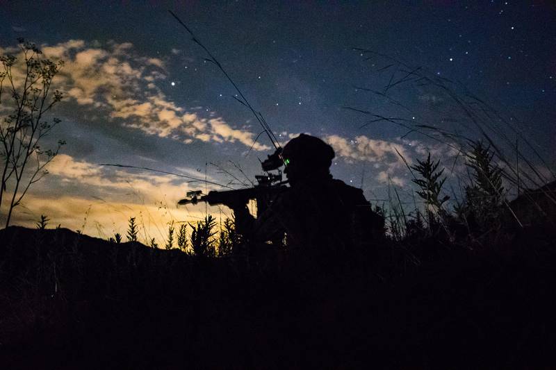 U.S. Marine Lance Cpl. James Esquibel, a rifleman with 3rd Battalion, 4th Marine Regiment, 1st Marine Division scans a road for notional enemies during a Marine Corps Combat Readiness Evaluation on Marine Corps Base Camp Pendleton, Calif., Aug. 12, 2020.
