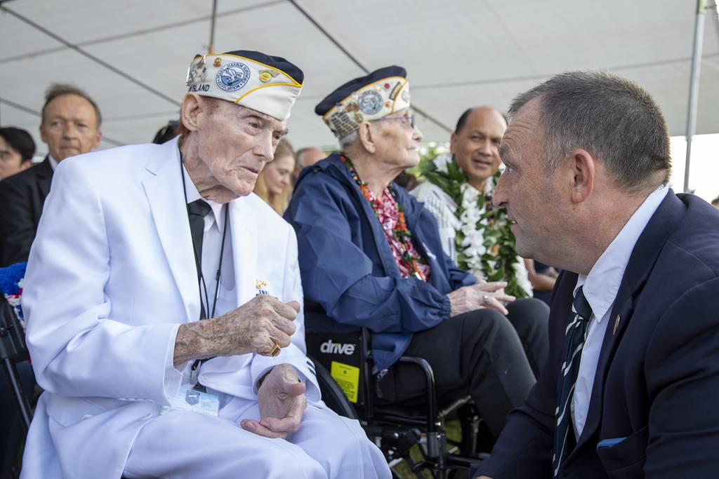 Hawaii Gov. Josh Green greets Pearl Harbor survivor, Jack Holder during a Pearl Harbor Remembrance ceremony on Dec. 7, 2022.