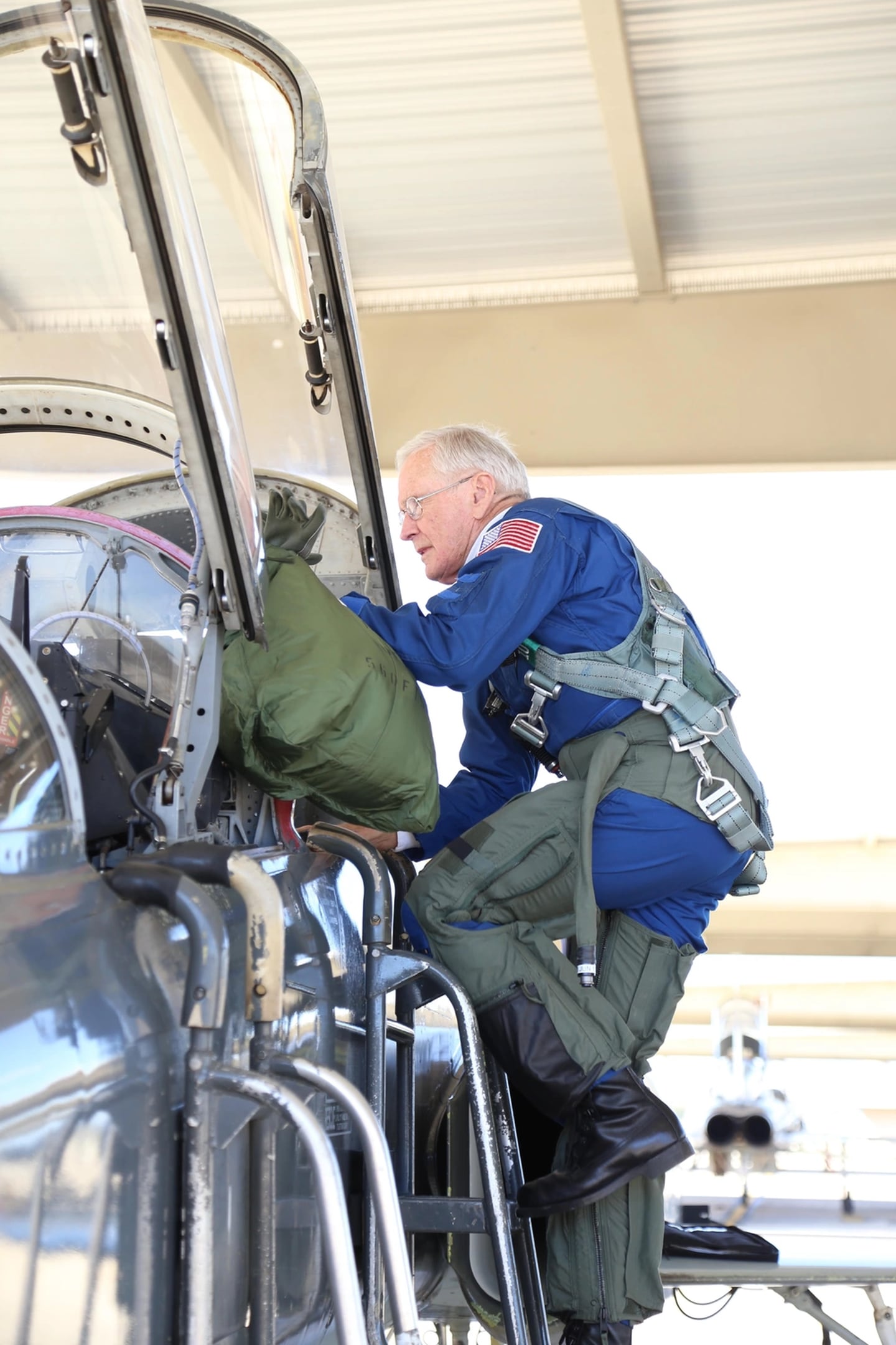 Retired Air Force Brig. Gen. Charlie Duke, Apollo 16 astronaut and 10th person to walk on the moon, climbs into a 560th Flying Training Squadron T-38 Talon before an incentive flight Feb. 19, 2015, at Joint Base San Antonio-Randolph, Texas. (Airman 1st Class Alexandria Slade/Air Force)