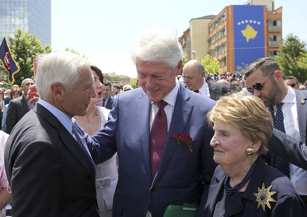Former U.S. President Bill Clinton, center, speaks with ex-Secretary of State Madeleine Albright, right, and then-NATO commander Wesley Clark during anniversary celebrations in the capital Pristina, Kosovo, Wednesday, June 12, 2019.