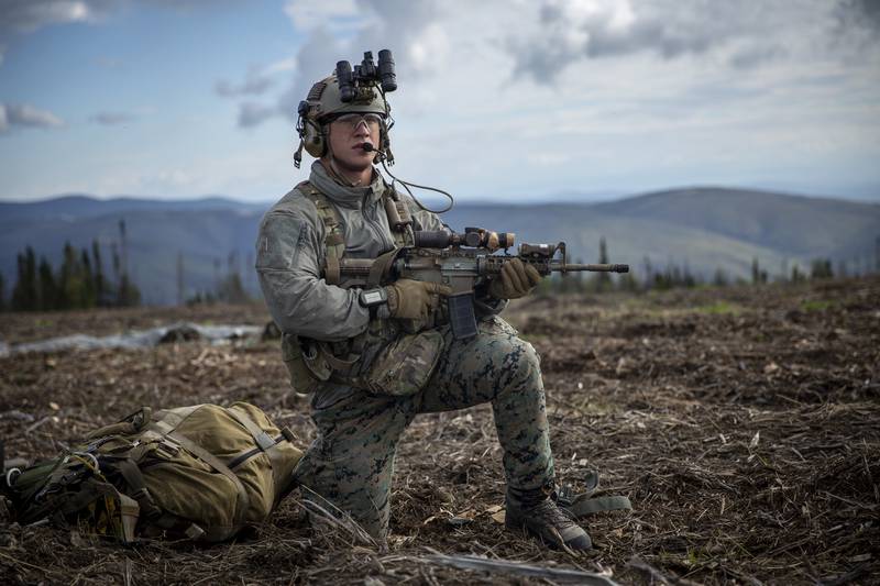 Hospital Corpsman 3rd Class Wayne Jaworski provides security after completing a free-fall insert during a Marine Corps combat readiness evaluation at Eielson Air Force Base, Alaska, Aug. 21, 2020.