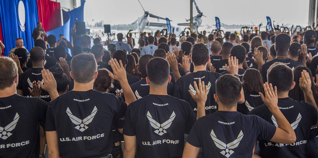 U.S. Air Force recruits take the oath of enlistment during the National Salute to America’s Heroes on Coast Guard Air Station Miami, Opa-Locka, Fl., May 24, 2019.