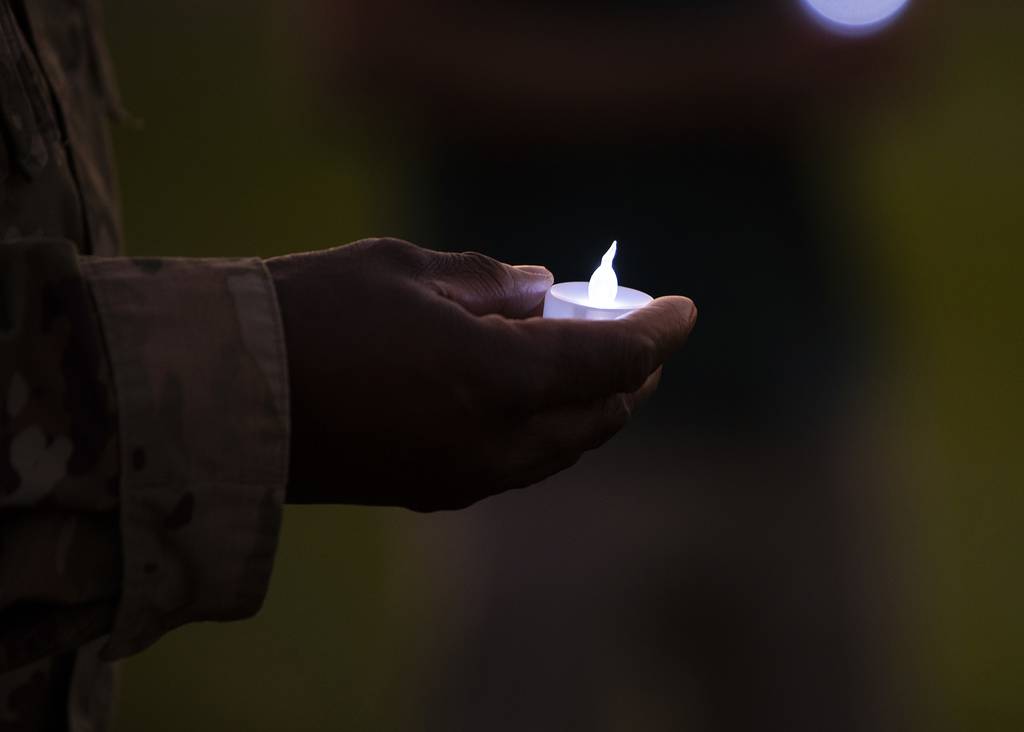 Air Force Maj. Onyema Okorie, 366th Fighter Wing deputy wing chaplain, holds a tea-light candle, Sept. 30, 2020, at Mountain Home Air Force Base, Idaho.