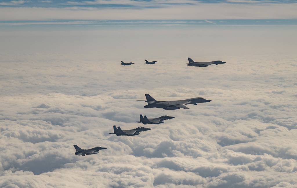 In this photo provided by South Korea Defense Ministry, U.S. Air Force B-1B bombers, F-16 fighter jets, South Korean Air Force F-15K fighter jets and Japanese Air Force F-2 fighter jets fly over South Korea's southern island of Jeju during a joint air drill, Wednesday, Dec. 20, 2023.