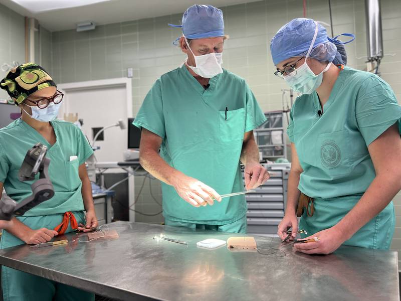 VA Surgeon James T. Quann, M.D. teaches surgical residents physician assistant students including Nara Tashjian, MD (left) and Elizabeth Patton.
