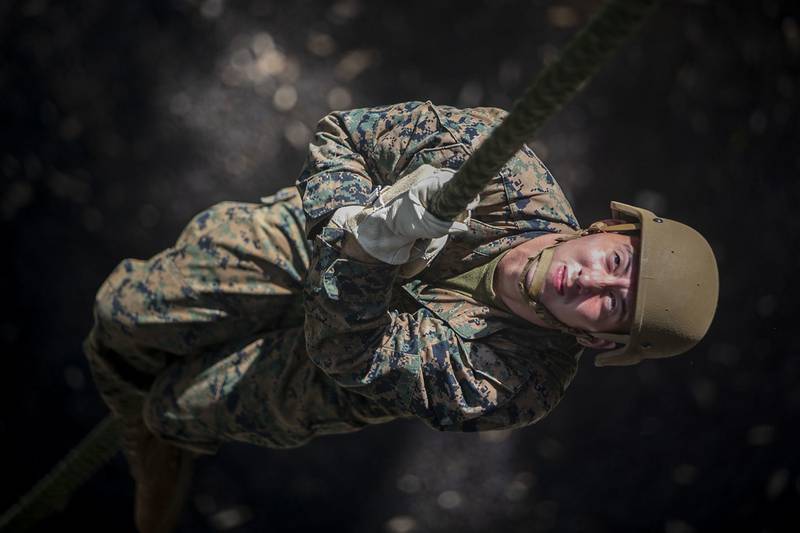 Marine Corps Lance. Cpl. Jonathen Figueroa conducts a fast roping exercise at the Lightning Academy, East Range Training Complex, Hawaii, Aug. 11, 2020.