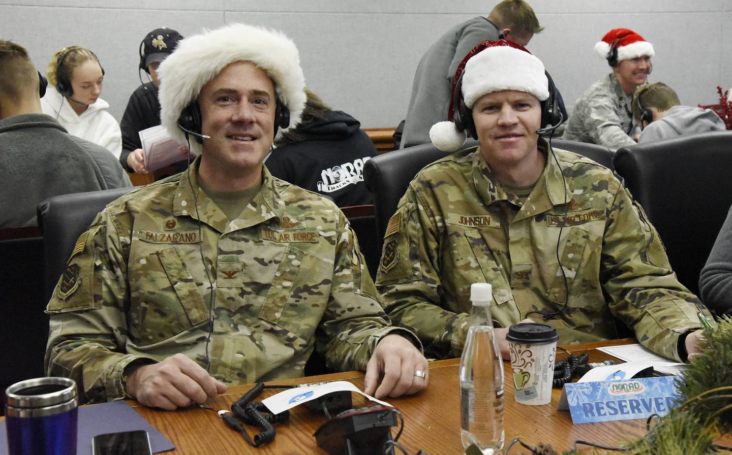 Col. Thomas Falzarano, 21st Space Wing commander, and Col. Sam Johnson, 21st SW vice commander, volunteer as official NORAD Santa Trackers at the 2019 NORAD Tracks Santa Operation Center on Peterson Air Force Base, Colo., on Dec. 24, 2019.