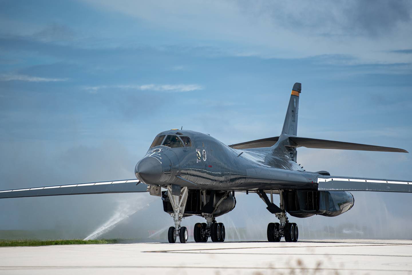 A U.S. Air Force B-1B Lancer assigned to the 37th Expeditionary Bomb Squadron, Ellsworth Air Force Base, South Dakota, taxis through a clean water wash station at Andersen Air Force Base, Guam, Oct. 18, 2022. These missions enhance readiness, to include joint and multi-lateral, to respond to any potential crisis or challenge in the Indo-Pacific. (Senior Airman Yosselin Campos/Air Force)