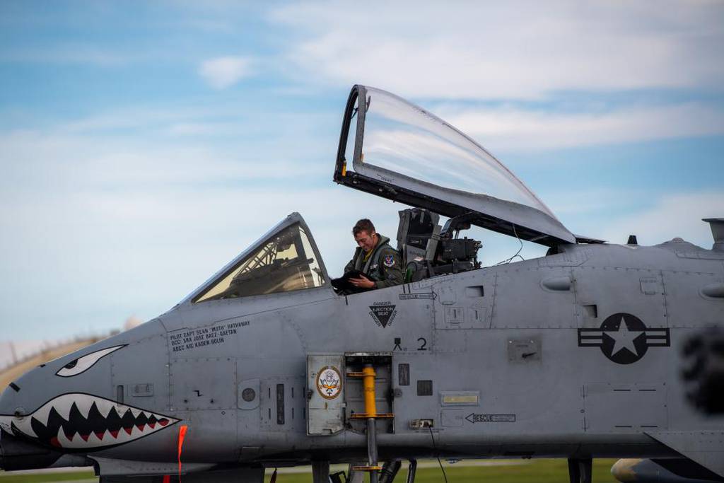 A U.S. Air Force A-10 Thunderbolt II pilot calculates air time and determines the aircraft's status upon arrival at Andersen Air Force Base, Guam, Oct. 23, 2022. This aircraft flew from Moody Air Force Base, Georgia, in support of a "dynamic force employment" operation, which is designed as a way for Pacific Air Forces to exercise their ability to generate combat air power from dynamic force elements while continuing to move, maneuver, and sustain these elements in geographically-separated and contested environments. (Airman 1st Class Courtney Sebastianelli/Air Force)