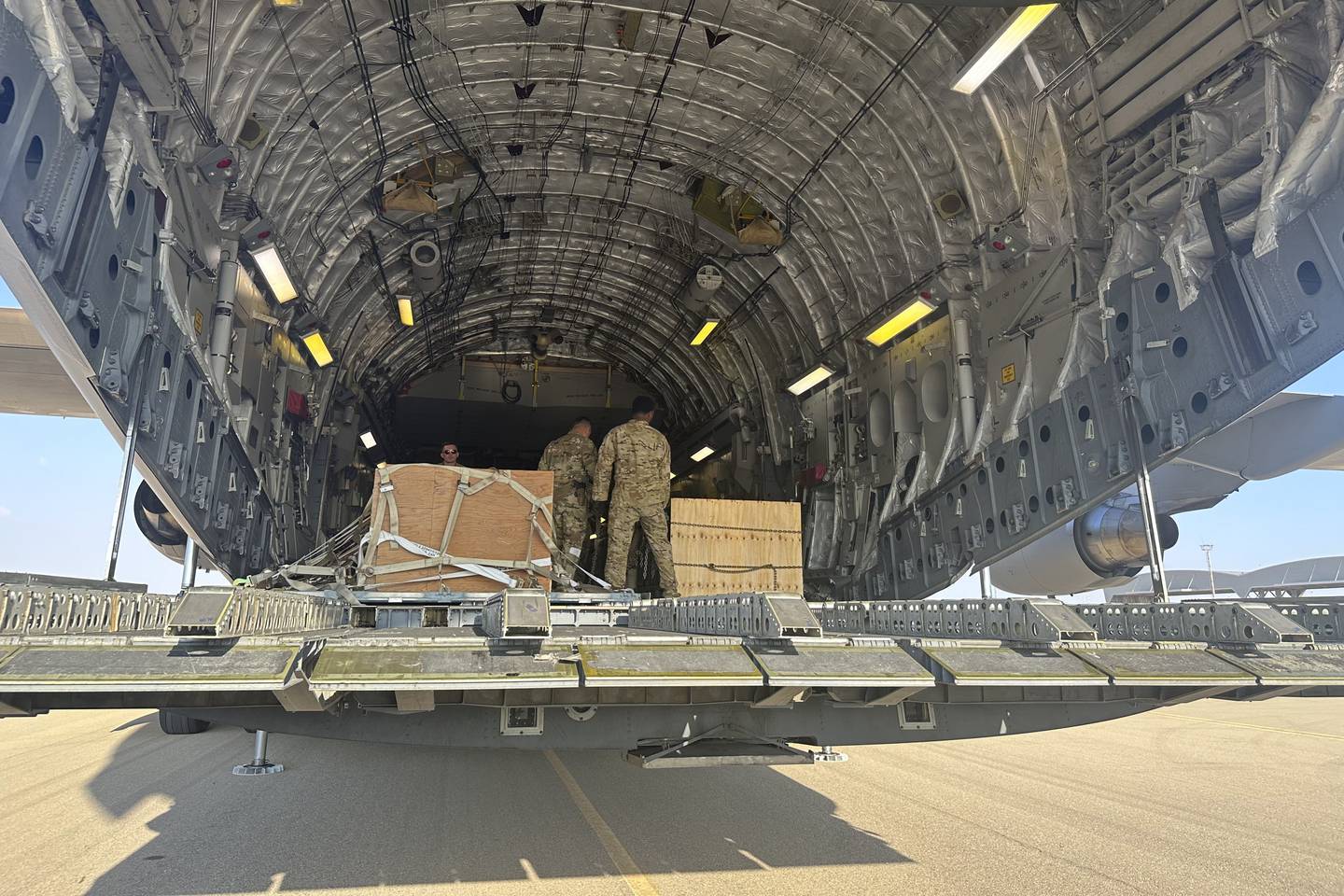 A U.S. C-17 sits at the Nevatim Air Base in the desert in Israel, Friday, Oct. 13, 2023. The aircraft arrived Friday with crates of American munitions for Israel.