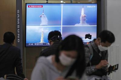 A TV screen shows files image of North Korea's missile launch during a news program at the Seoul Railway Station in Seoul, South Korea, Thursday, Sept. 29, 2022.