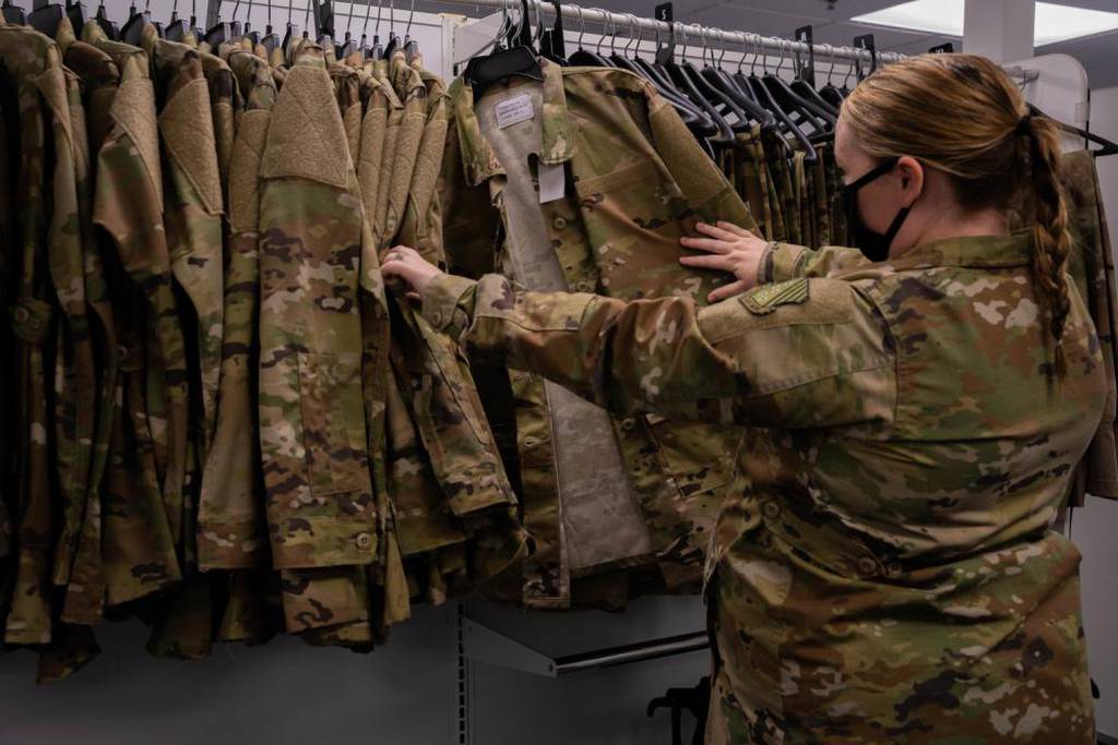 Senior Airman Quynn Santjer, unit deployment manager for the 94th Fighter Squadron, looks through the new abundance of maternity options at Joint Base Langley-Eustis, Virginia, Dec. 2, 2021. (Staff Sgt. Jaylen Molden/Air Force)