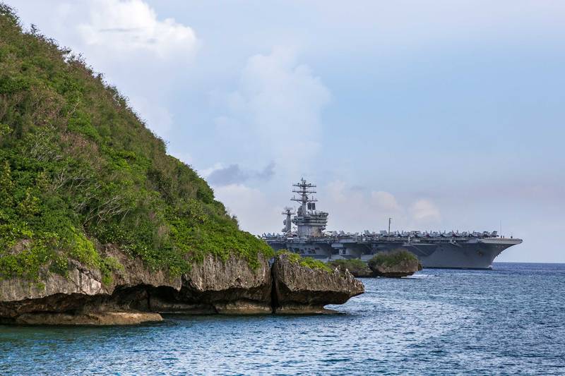 The aircraft carrier USS Nimitz (CVN 68) passes Point Udall as it enters Apra Harbor on June 24, 2020, prior to mooring at Naval Base Guam for a scheduled port visit.