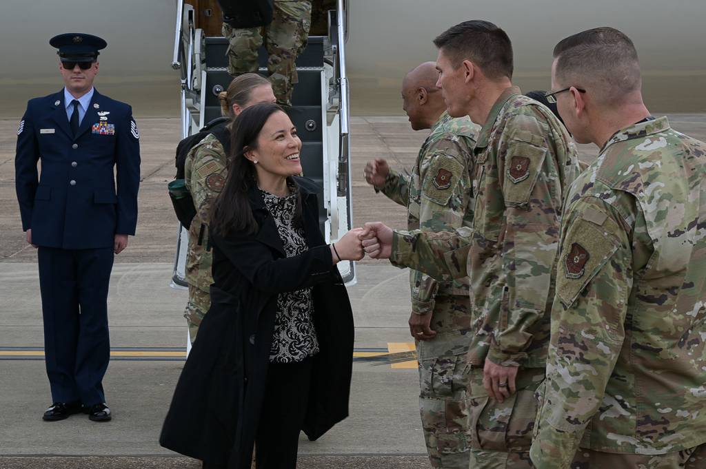 Leaders from Air Force Global Strike Command and 2nd Bomb Wing greet the Honorable Gina Ortiz Jones, Under Secretary of the Air Force, during her arrival to Barksdale Air Force Base, Louisiana, April 12, 2022.