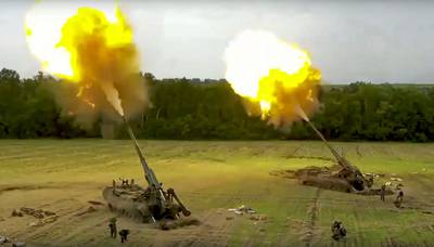 In this handout photo taken from video released by the Russian Defense Ministry Press Service on Thursday, Aug. 25, 2022, Russian Malka artillery systems fire from an undisclosed location in Ukraine.