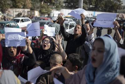 Afghan women chant during a protest in Kabul, Afghanistan, Thursday, Oct. 21, 2021.