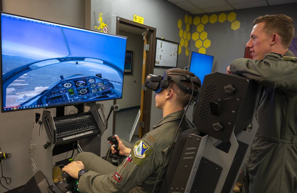 Pilots from the 85th Flying Training Wing use a virtual-reality flight simulator to run maneuvers in the classroom on March 30, 2021, at Laughlin Air Force Base, Texas. (Senior Airman Nicholas Larsen/Air Force)