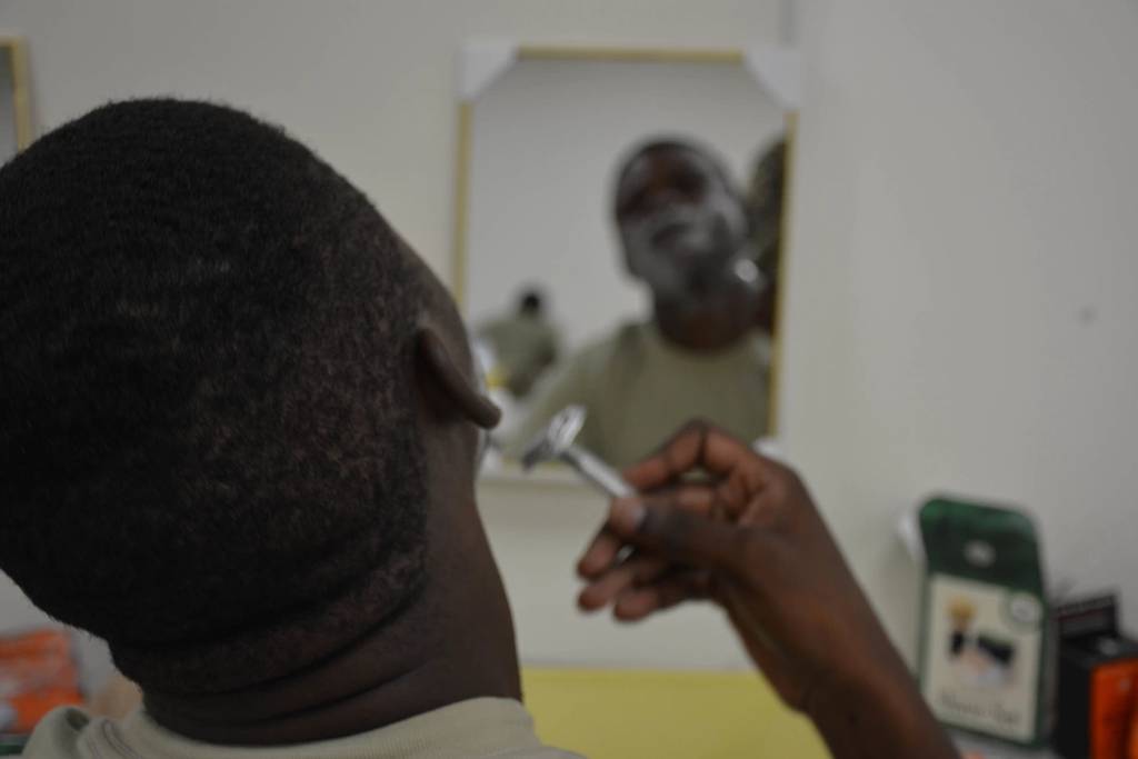 A soldier assigned to the 3rd Infantry Division Sustainment Brigade uses a single-blade razor to shave his face during a shaving clinic May 22, 2017, at the brigade's organizational classroom. The purpose of this clinic is to teach basic shaving skills in hopes of reducing the number of soldiers on shaving profiles. (Sgt. Caitlyn Smoyer/Army)