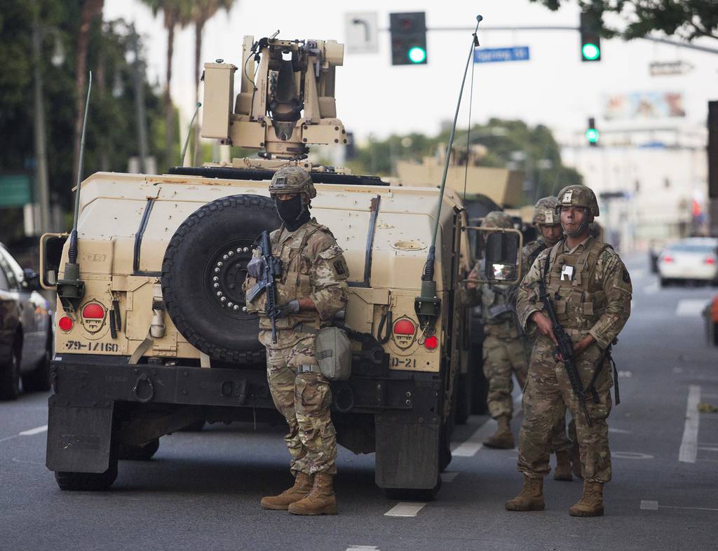 In this May 31, 2020, file photo, members of the California National Guard patrol, in Los Angeles.