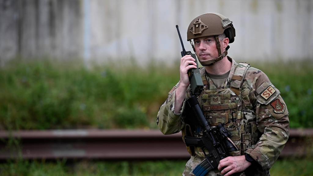 U.S. Air Force Tech. Sgt. Jordan Locke, 51st Security Forces Squadron defender, calls in a possible drone sighting during a training scenario at Osan Air Base, South Korea, Sept. 13, 2022. The training helped the defenders to improve their ability to identify and respond to drone sightings and enemy movements. (Senior Airman Trevor Gordnier/Air Force)