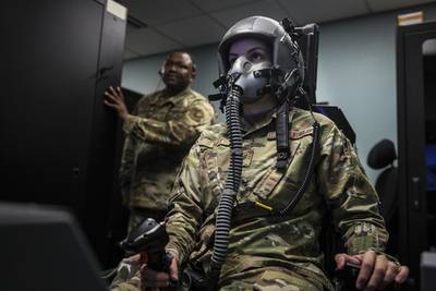 Staff Sgt. Kimberly May, noncommissioned officer in charge of aerospace and operations physiology for the 1st Special Operations Support Squadron, operates a hypoxia-familiarization trainer at Hurlburt Field, Florida, July 11, 2019. May and her team of five train aircrew by using a reduced oxygen breathing device (ROBD) to detect the signs of hypoxia during flight. Hypoxia is a condition caused by a lack of oxygen that can lead to injury to personnel, damage to Air Force assets and death. (Senior Airman Dennis Spain/Air Force)