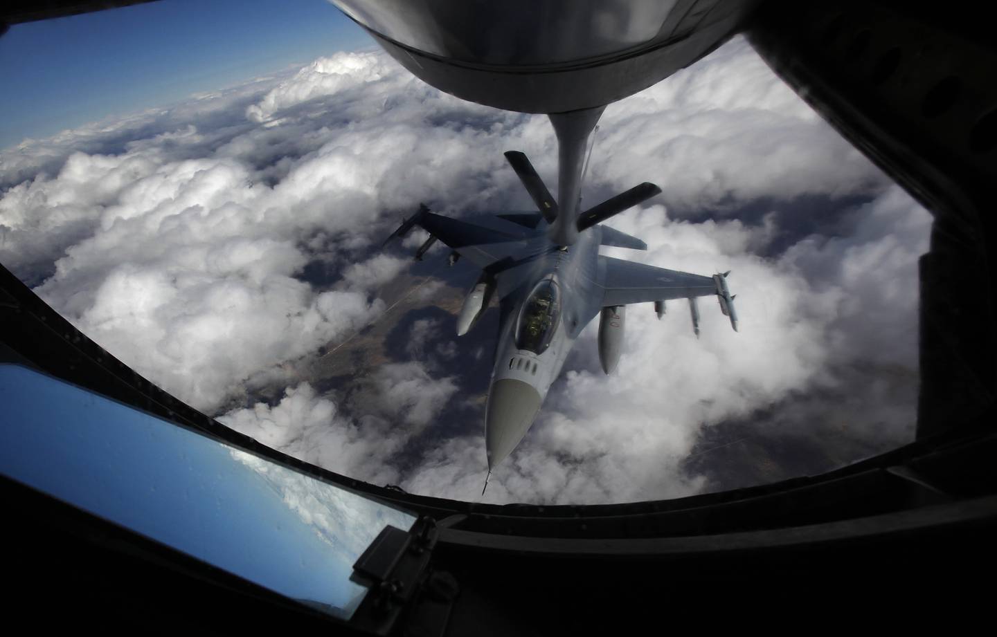 A U.S. Air Force F-16 refuels in mid-flight from a KC-135 Stratotanker during a Red Flag exercise over The Nevada Test and Training Range on Feb. 10, 2014.